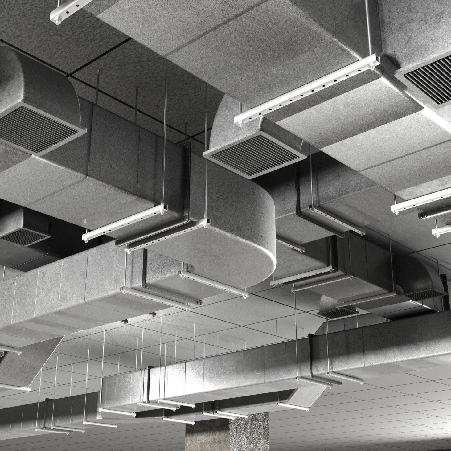 HVAC engineering system with air ducts and ventilation channels installed on the ceiling. Industrial air distribution and climate control infrastructure.